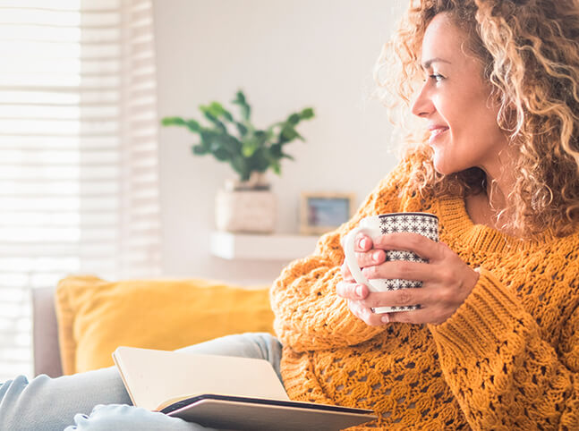 A woman reading and taking time to practice self-care