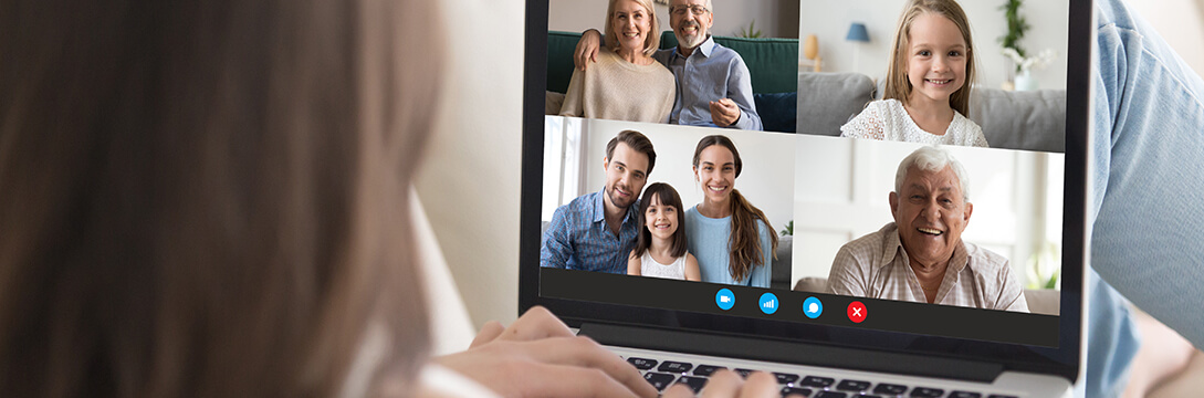 A woman making a video call and staying connected to family