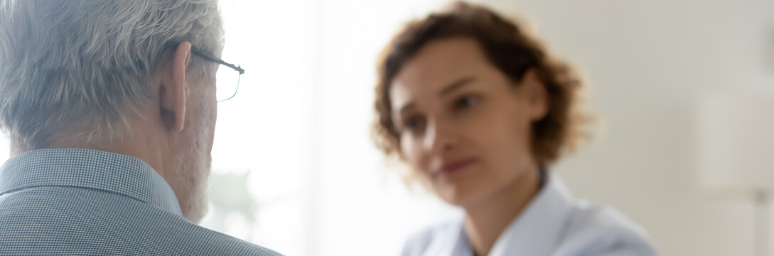 A man speaking with a therapist to help with depression or other mental health concerns