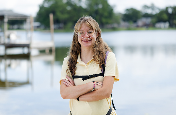 Nicole with arms crossed smiling spotlight image