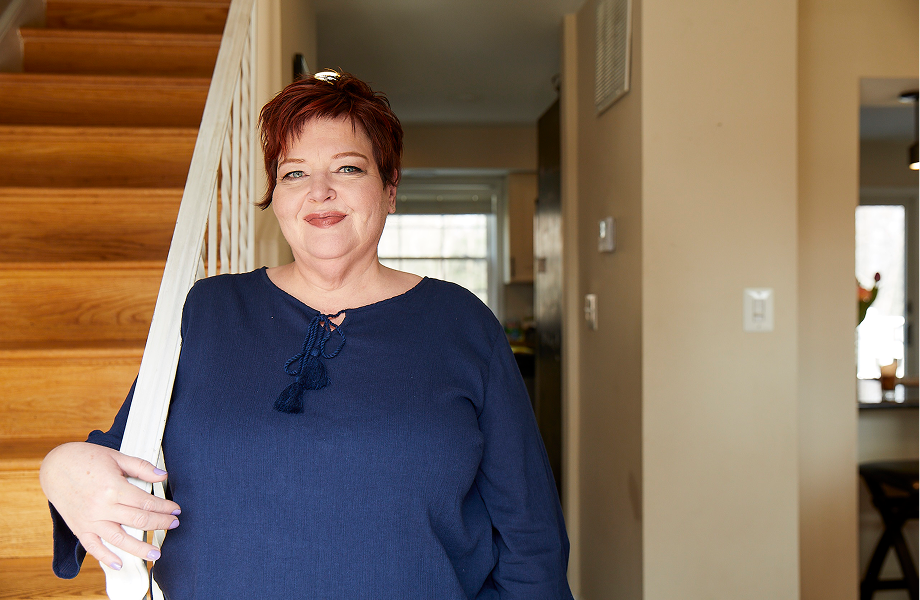 Karen next to stairs smiling