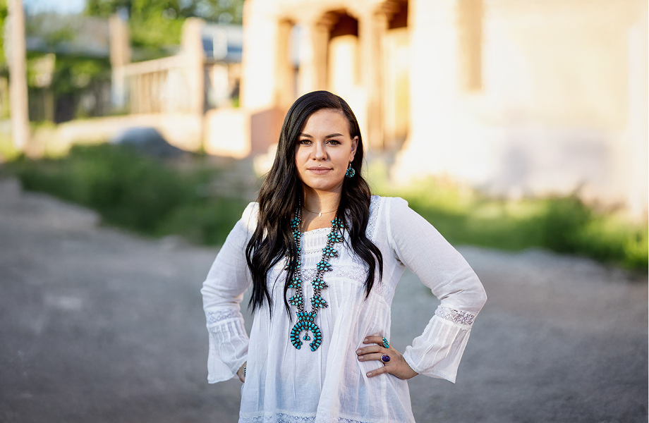 Haley standing outside with her hands on hips and smiling